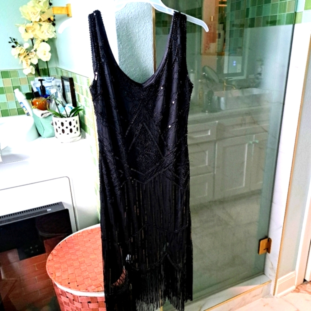 A snazzy, frilly party dress - Picture 3 of 3